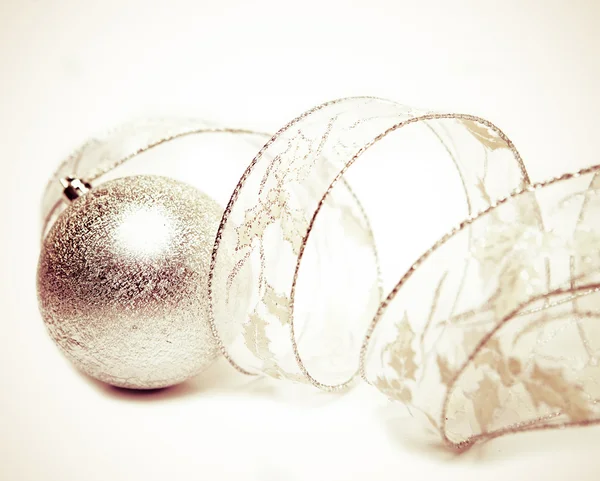 Beautiful silvery New Year's ball and elegant tinsel with a retro effect — Stock Photo, Image