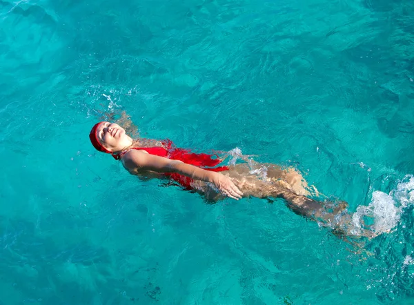 The sports girl swims in the sea — Stock Photo, Image