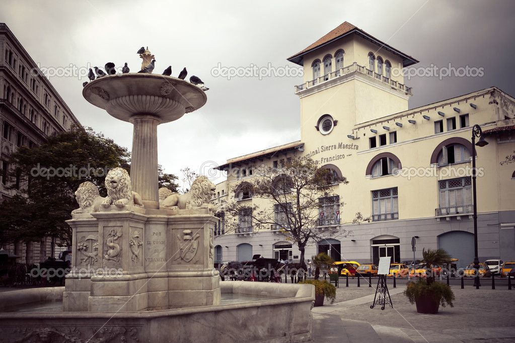 Cuba. Old Havana. Sierra Maestra Havana and fountain of lions on San Francisco Square,with a retro effect