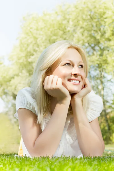 Beautiful smiling blonde woman relaxing Stock Photo