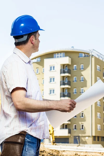 Construction manager holding project — Stock Photo, Image