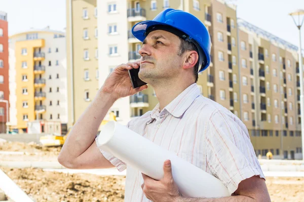 Construction manager holding project — Stock Photo, Image