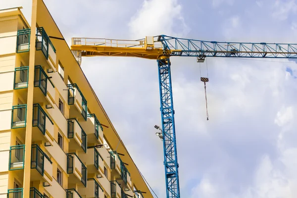Construction crane with building — Stock Photo, Image