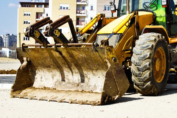 Bulldozer on building site — Stock Photo, Image