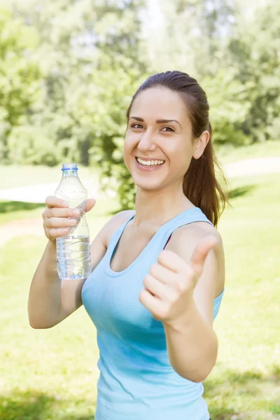 Happy fitness girl relaxing after exercising — Stock Photo, Image