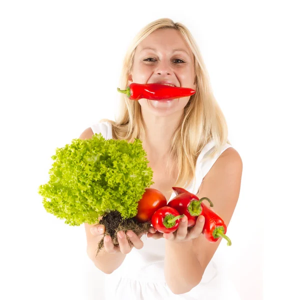 Gelukkig blonde vrouw met plantaardige — Stockfoto