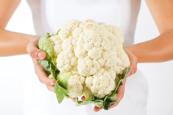 Woman hands holding cauliflower — Stock Photo, Image
