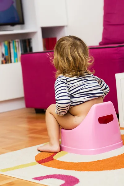 Little girl sitting on the potty — Stock Photo, Image