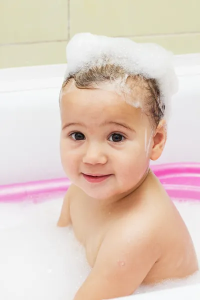 Little girl playing in the bath — Stock Photo, Image