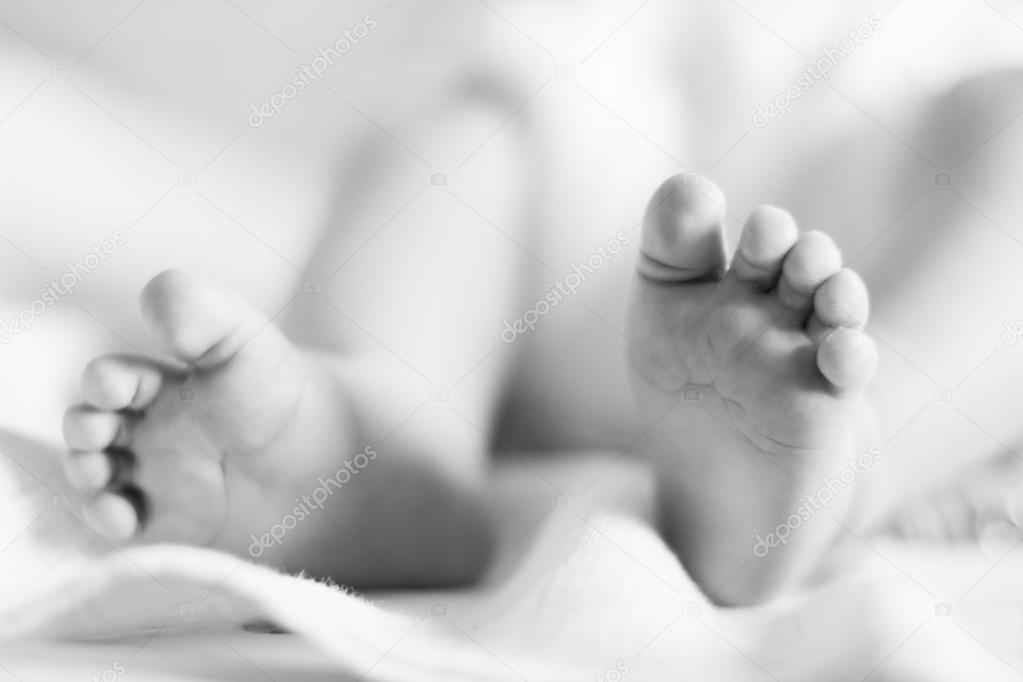 Newborn baby feet Stock Photo by ©MitaStockImages 43251563
