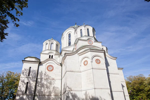 Serbian Orthodox Church, St. Georges Church In Oplenac, Topola, Serbia. Mausoleum of The Royal Family of Serbia. Beautiful Sunny Autumn Day. Clear Blue Sky With Clouds. Exterior View. Religion Travel Destination.