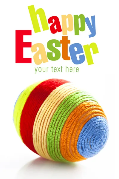 Easter egg with colorful woolen yarn — Stock Photo, Image