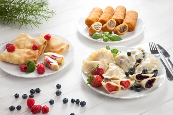 Dumplings Strawberries Blueberries Pancakes Raspberries Croquettes Cabbage Meat Table — Stok fotoğraf