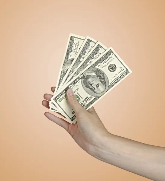 Hand met geld — Stockfoto