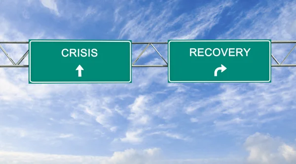 Road sign to recovery and crisis — Stock Photo, Image