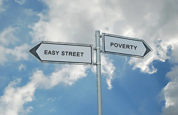 Sinais de trânsito para rua fácil e pobreza — Fotografia de Stock