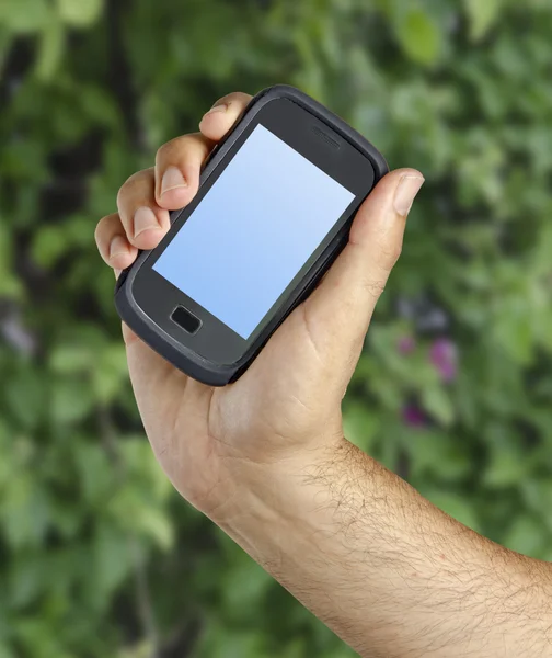 Smartphone in hand — Stock Photo, Image