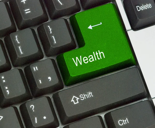 Klávesnice s klíčem pro bohatství — Stock fotografie