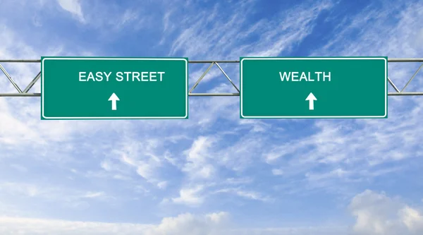 Dopravní značka easy street a bohatství — Stock fotografie