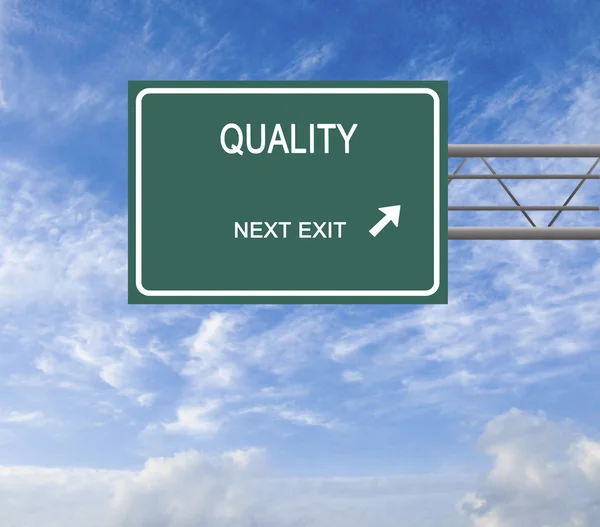 Road sign to quality — Stock Photo, Image