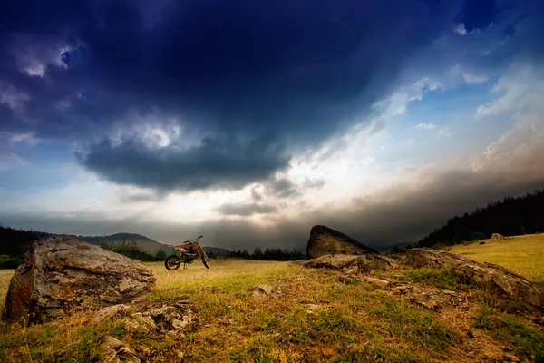 Sunset landscape with dirt bike — Stock Photo, Image