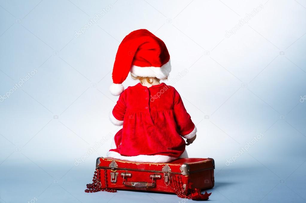 Rear view of child with Santa cap
