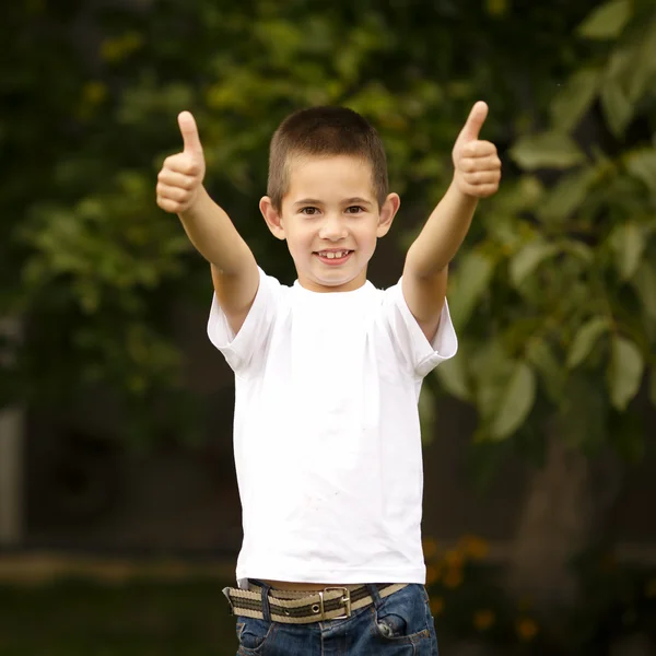 Happy boy shows thumbs up — Stock Photo, Image