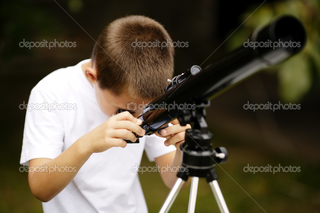 Little boy with telescope