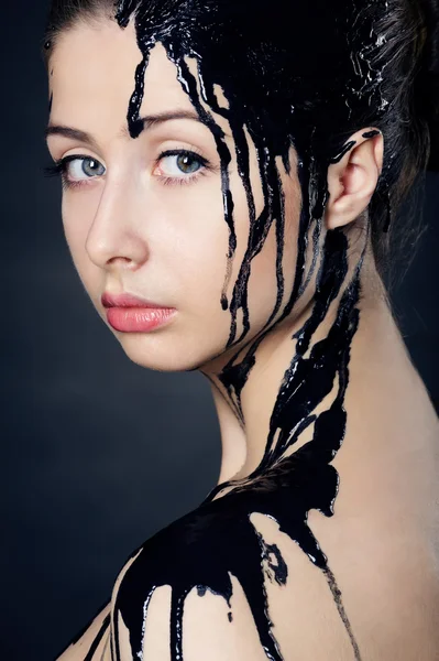 Beautiful girl with flowing down the face paint — Stock Photo, Image