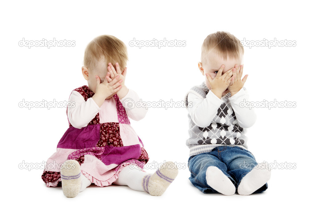 Little boy and girl covers his face