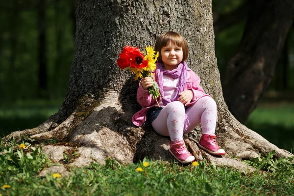 Little sweet girl with flowers — Stock Photo, Image