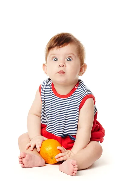 Cute baby with orange — Stock Photo, Image