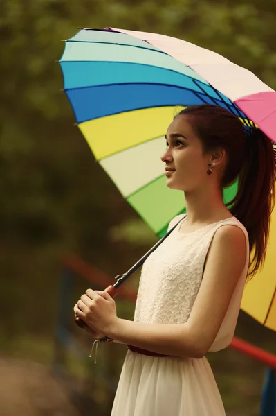 Beautiful girl with colorful umbrella — Stock Photo, Image