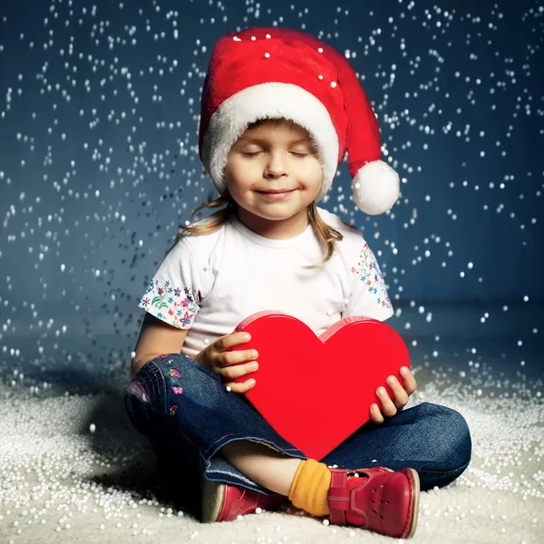 Bambina carina con cappello da Babbo Natale — Foto Stock