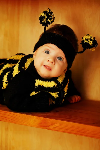 Little funny baby with bee costume — Stock Photo, Image