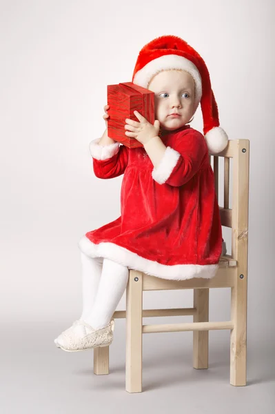 Little happy girl with gift — Stock Photo, Image