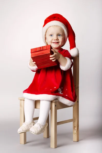 Little happy girl with gift — Stock Photo, Image