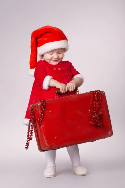 Niña feliz con la maleta de Navidad —  Fotos de Stock