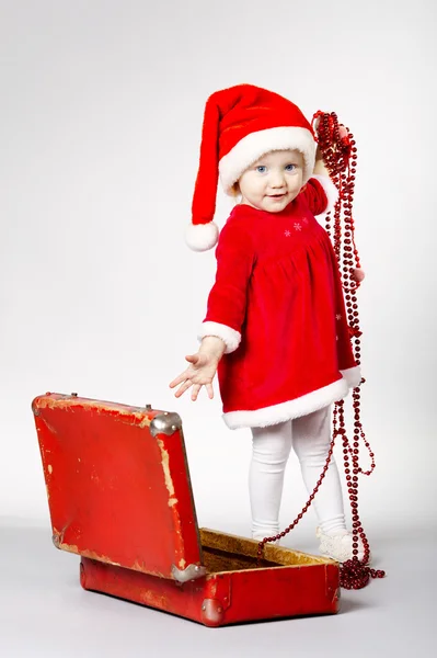 Little cute girl with christmas suitcase — Stock Photo, Image