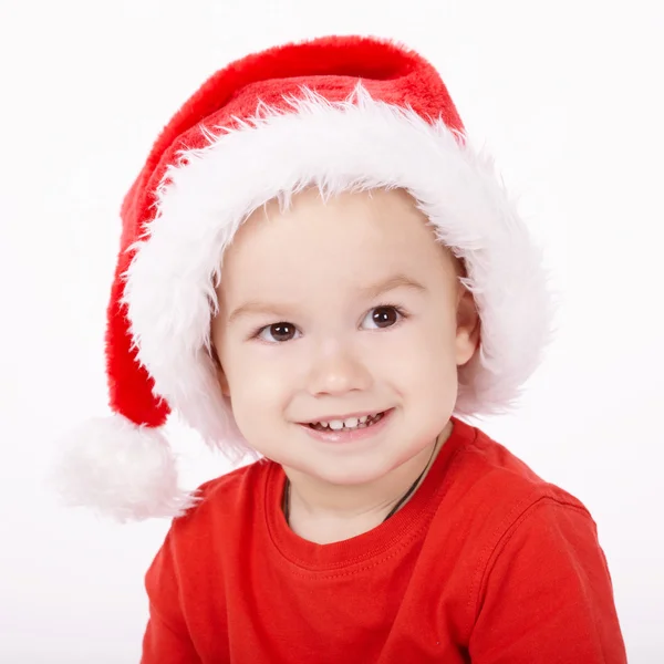 Petit garçon avec chapeau de Père Noël — Photo