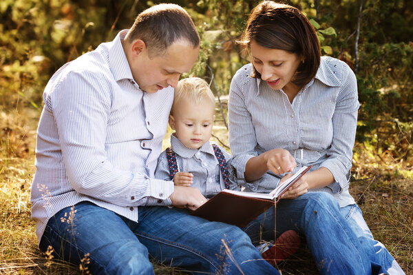 Happy family reading book