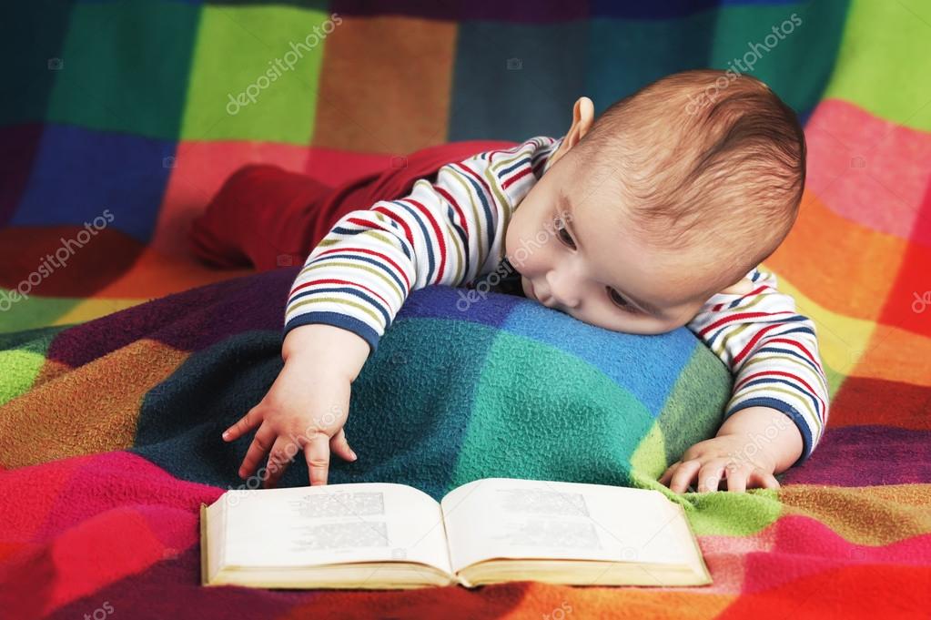 Cute little baby reading book Stock Photo by ©ababaka 37938307