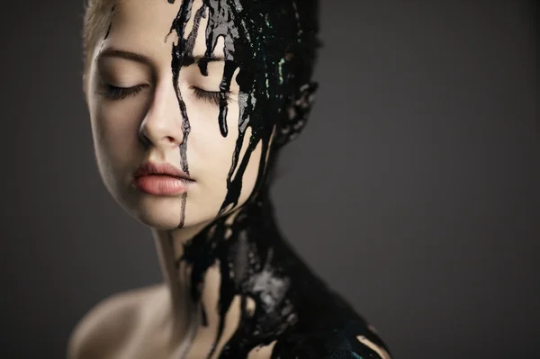 Beautiful girl with flowing down face paint — Stock Photo, Image