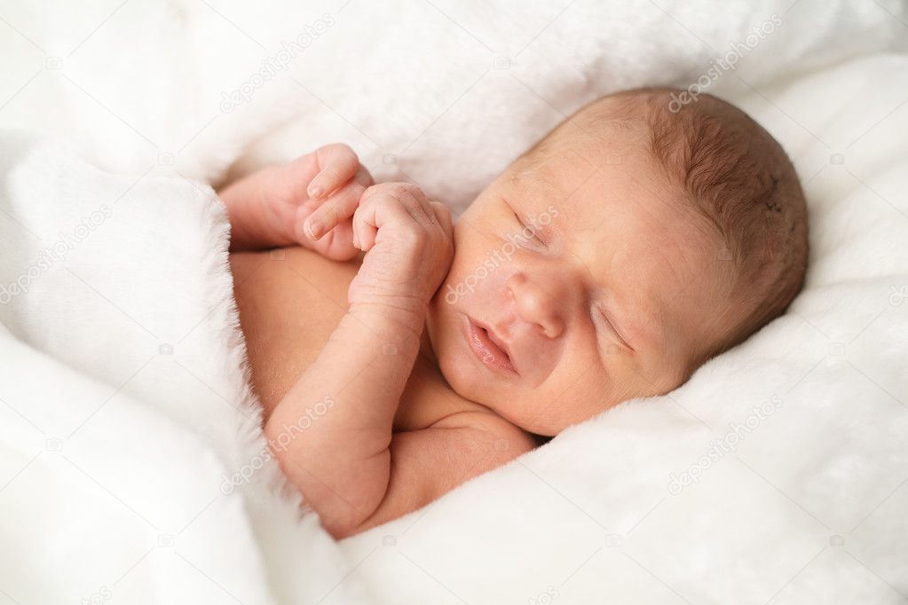 portrait of cute newborn sleeping baby
