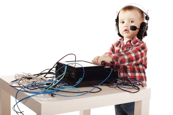 Little ingeneer with headphones — Stock Photo, Image