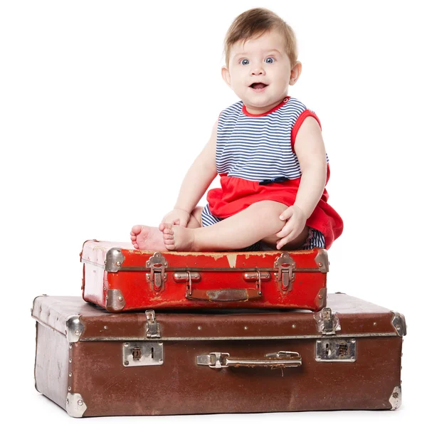Baby with suitcase isolated on white Stock Picture