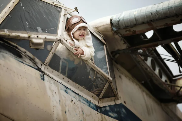 Sweet baby dreaming of being pilot — Stock Photo, Image