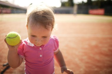 little girl plays tennis clipart