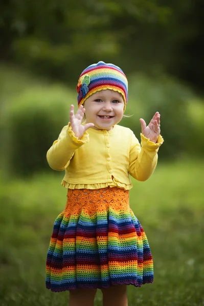 Little girl greets hands up — Stock Photo, Image