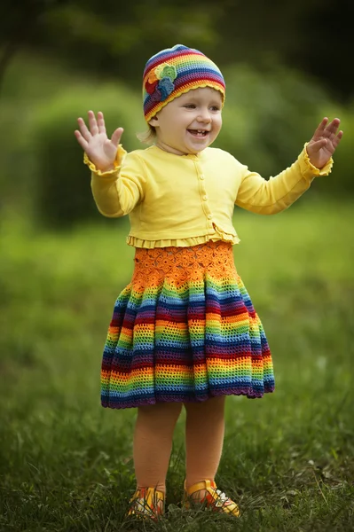 Little girl greets hands up — Stock Photo, Image